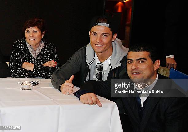 Ballon d'Or winner Cristiano Ronaldo poses with his parents Hugo Aveiro and Dolores Aveiro after the Ballon d'Or competition January 13, 2014 in...