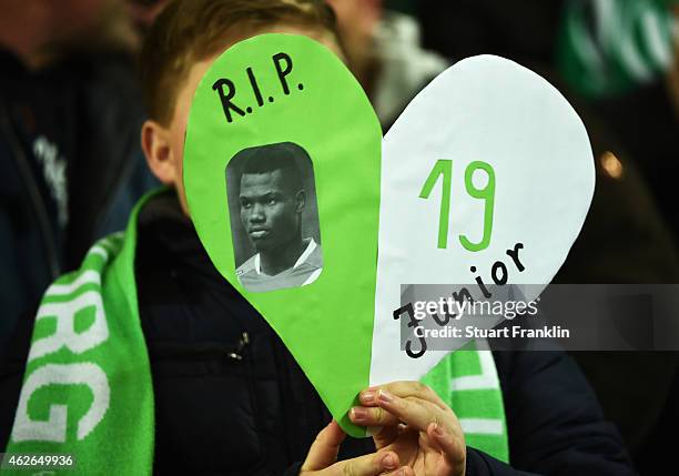 Fans remember former Wolfsburg player Junior Malanda, recently died in a car crash, prior to the Bundesliga match between VfL Wolfsburg and FC Bayern...