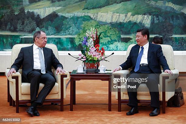 Russian Foreign Minister Sergei Lavrov and Chinese President Xi Jinping hold a meeting at the Great Hall of the People on February 2, 2015 in...