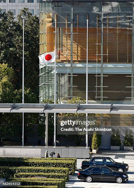 Japanese national flag is hoisted at half-mast to offer condolence to killed journalist Kenji Goto at Prime Minister Shinzo Abe's official residence...