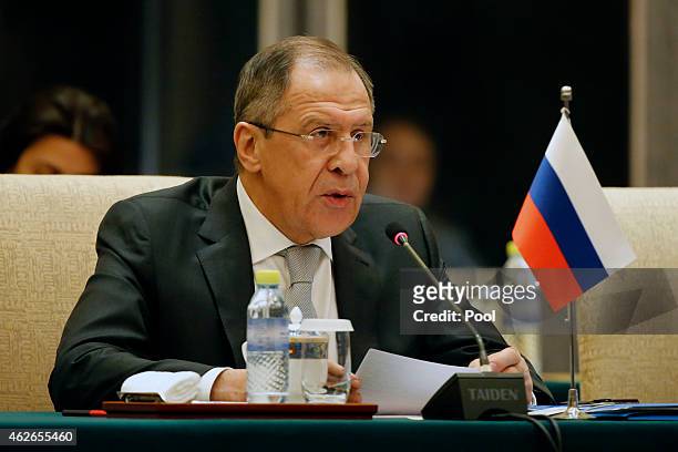 Russian Foreign Minister Sergei Lavrov speaks during the 13th trilateral meeting of Foreign Ministers from Russia, India and China at Diaoyutai State...