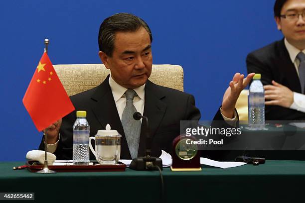 Chinese Foreign Minister Wang Yi speaks during the 13th trilateral meeting of Foreign Ministers from Russia, India and China at Diaoyutai State...