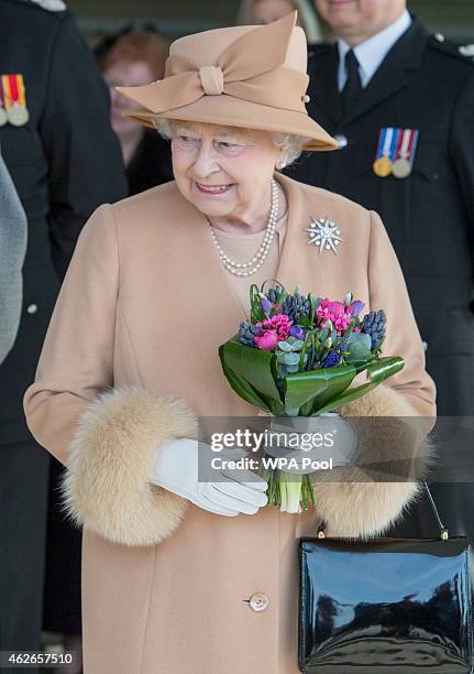 Queen Elizabeth II accompanied by Prince Philip, Duke of Edinburgh, formally opens the new South Lynn Fire Station on February 2, 2015 in King's...