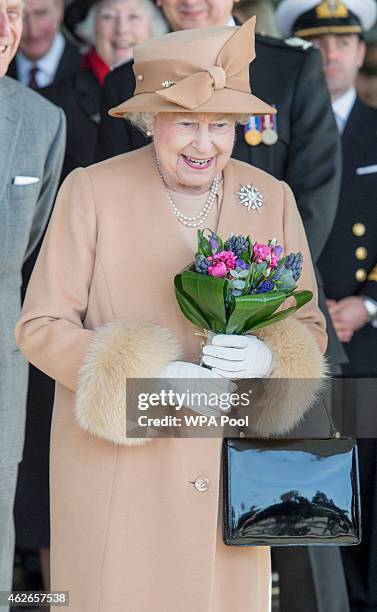 Queen Elizabeth II accompanied by Prince Philip, Duke of Edinburgh, formally opens the new South Lynn Fire Station on February 2, 2015 in King's...