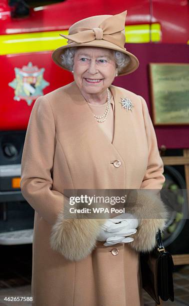 Queen Elizabeth II accompanied by Prince Philip, Duke of Edinburgh, formally opens the new South Lynn Fire Station on February 2, 2015 in King's...