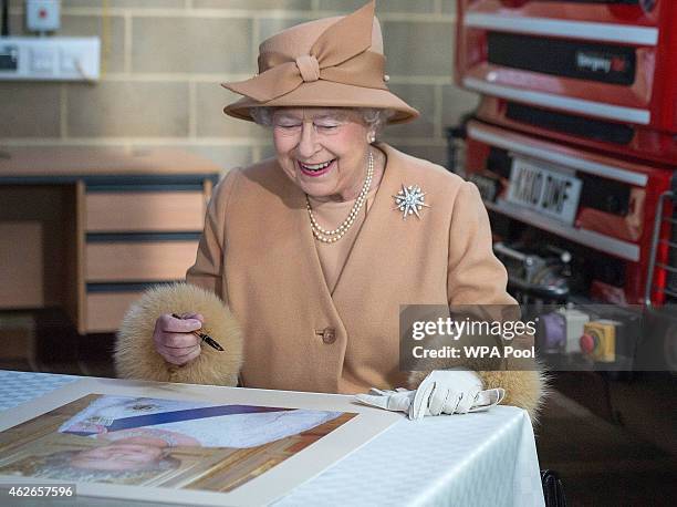 Queen Elizabeth II accompanied by Prince Philip, Duke of Edinburgh, formally opens the new South Lynn Fire Station on February 2, 2015 in King's...