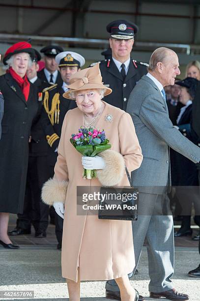 Queen Elizabeth II accompanied by Prince Philip, Duke of Edinburgh formally opens the new South Lynn Fire Station on February 2, 2015 in King's Lynn,...