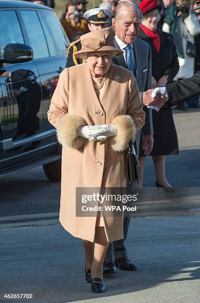 Queen Elizabeth II accompanied by Prince Philip, Duke of Edinburgh formally opens the new South Lynn Fire Station on February 2, 2015 in King's Lynn,...