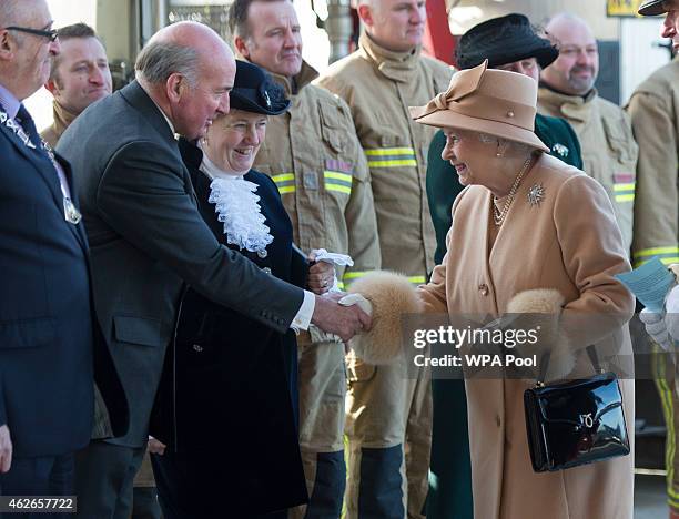 Queen Elizabeth II meets Lord Dannett as she formally opens the new South Lynn Fire Station on February 2, 2015 in King's Lynn, Norfolk, England.