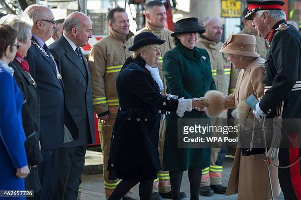 Queen Elizabeth II greets guests as she formally opens the new South Lynn Fire Station on February 2, 2015 in King's Lynn, Norfolk, England.