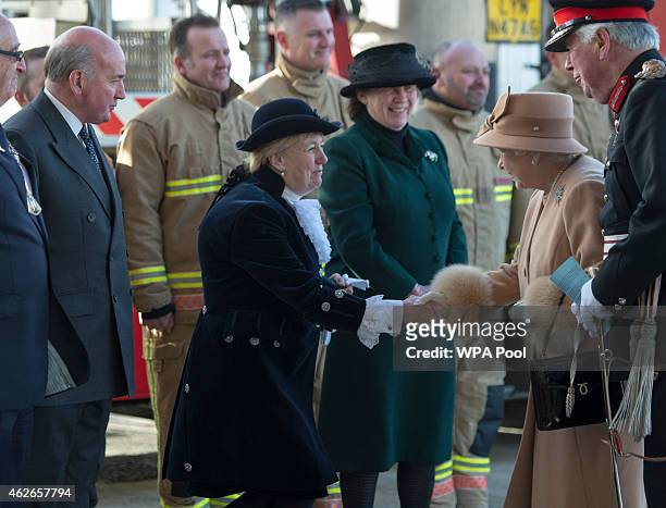 Queen Elizabeth II greets guests as she formally opens the new South Lynn Fire Station on February 2, 2015 in King's Lynn, Norfolk, England.