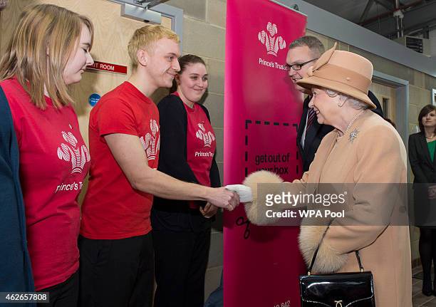 Queen Elizabeth II greets volunteers from The Prince's Trust as she formally opens the new South Lynn Fire Station on February 2, 2015 in King's...