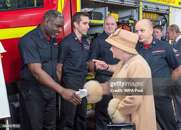 Queen Elizabeth II greets firefighters as she formally opens the new South Lynn Fire Station on February 2, 2015 in King's Lynn, Norfolk, England.
