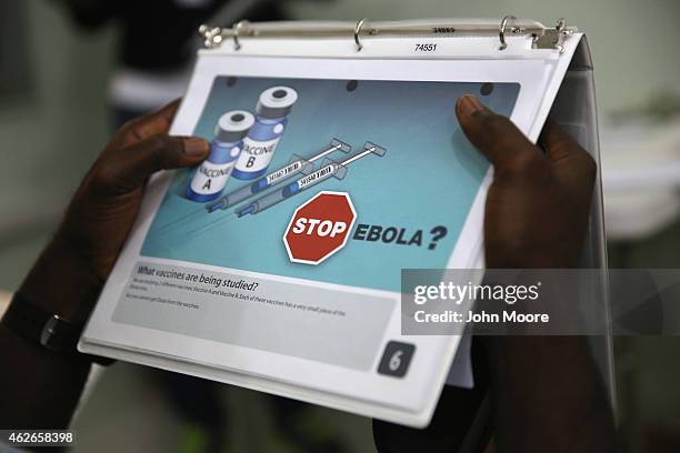 Emmanuel Lansana takes part in a briefing before becoming the first person to be injected in the Ebola vaccine trials, which were launched at...