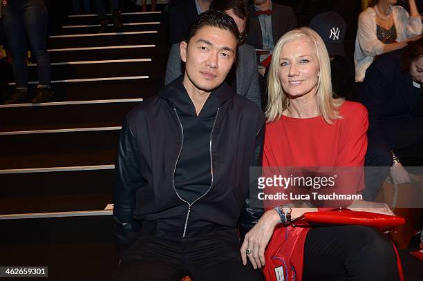 Rick Yune and Joely Richardson attend the Kilian Kerner show during Mercedes-Benz Fashion Week Autumn/Winter 2014/15 at Brandenburg Gate on January...