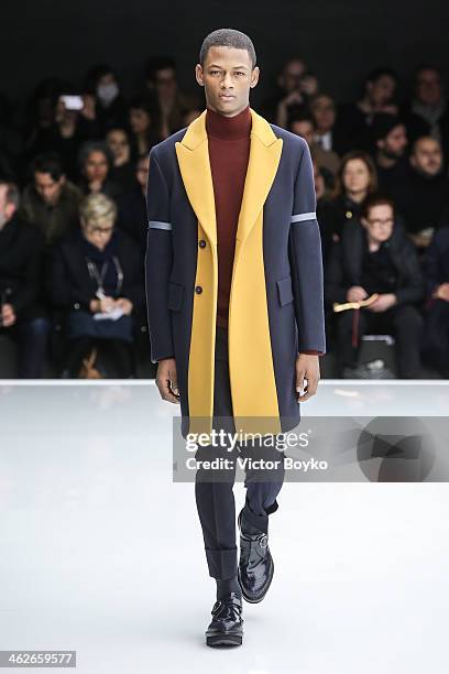 Model walks the runway during the Z Zegna show as part of Milan Fashion Week Menswear Autumn/Winter 2014 on January 14, 2014 in Milan, Italy.