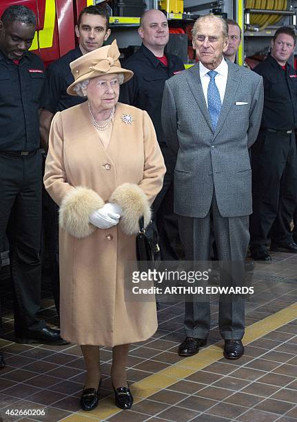 Britain's Queen Elizabeth II and Prince Philip, Duke of Edinburgh, visit the South Lynn Fire Station to officially open the new facility at King's...