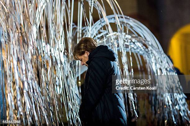 German Chancellor Angela Merkel stays in front of the "Tree of Life" in the Dohany Street Great Synagogue, on February 2, 2015 in Budapest, Hungary....