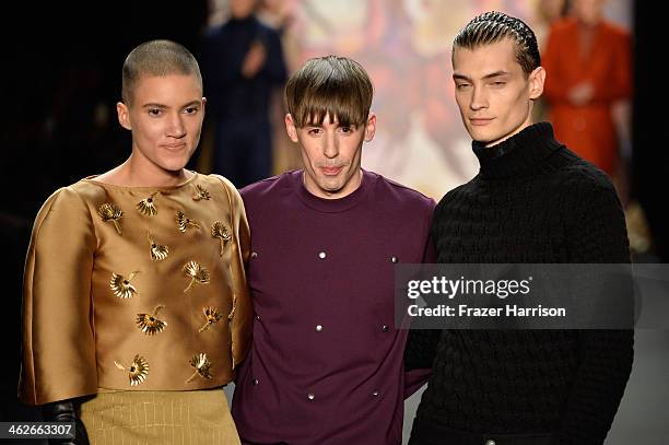 Designer Kilian Kerner acknowledges the audience at the Kilian Kerner show during Mercedes-Benz Fashion Week Autumn/Winter 2014/15 at Brandenburg...