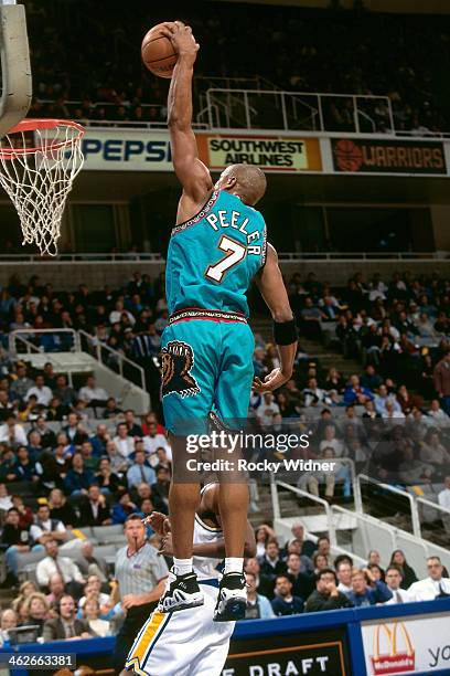 Anthony Peeler of the Vancouver Grizzlies dunks against the Golden State Warriors during a game played on January 8, 1997 at San Jose Arena in San...