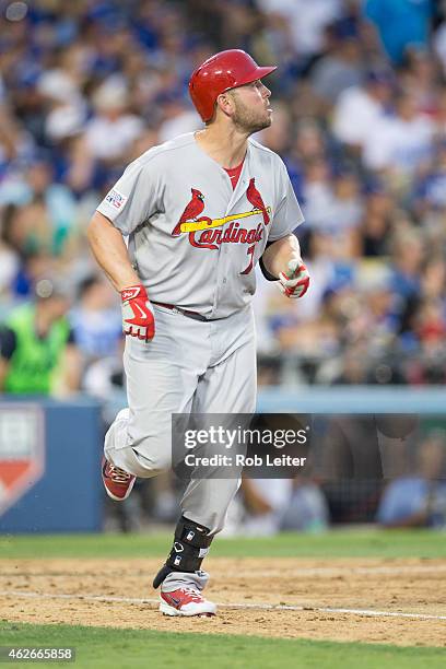 Matt Holliday of the St. Louis Cardinals hits a three-run home run in the seventh inning of Game 1 of the NLDS against the Los Angeles Dodgers at...