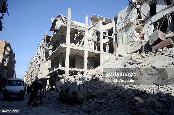 Many buildings are demolished after Syrian regime's air forces' air attack on East Ghouta region with 'Vacuum Bomb' that killed at least 10 people...