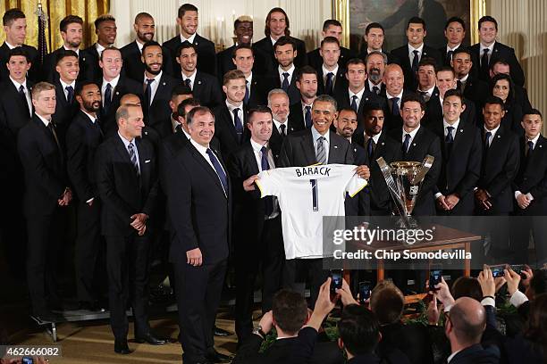 President Barack Obama poses for photographs with Major League Soccer champions Los Angeles Galaxy in the East Room of the White House February 2,...