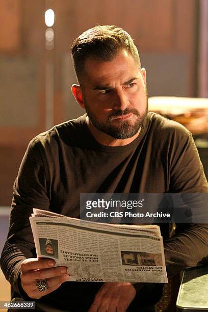 De Los Muertos" - Nick Stokes takes a moment to read the paper while in Mexico helping Dr. Robbins process evidence in association with a girl's body...