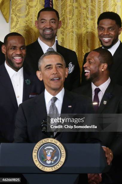 President Barack Obama speaks as National Basketball Association 2012-2013 champion Miami Heat players LeBron James, Juwan Howard, Dwyane Wade and...