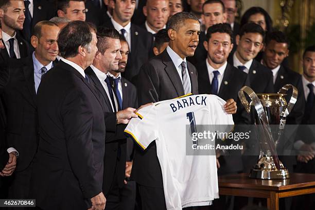 President Barack Obama poses for photographs with Major League Soccer champions Los Angeles Galaxy in the East Room of the White House February 2,...