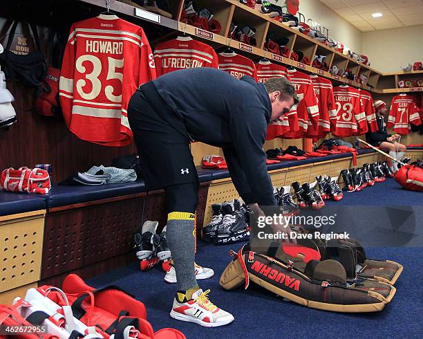 Jimmy Howard of the Detroit Red Wings prepares his gear in the locker room before the Bridgestone NHL Winter Classic game against the Toronto Maple...