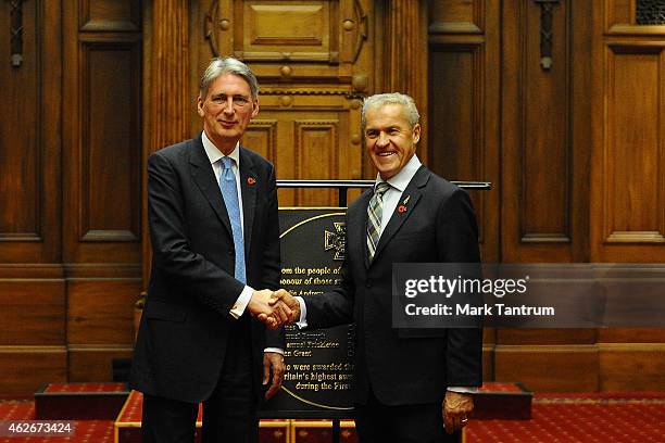 Secretary of State for Foreign and Commonwealth Affairs Philip Hammond presents a plaque to the Speaker of the New Zealand Parliament David Carter at...