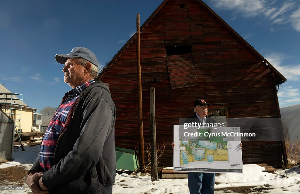 Rick Grippa, left at his family farm in unincorporated Adams County which will become the Clear Creek Valley Park and Community Gardens under Hyland Hills Parks and Recreation District.