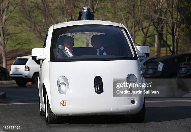 Transportation Secretary Anthony Foxx and Google Chairman Eric Schmidt ride in a Google self-driving car at the Google headquarters on February 2,...