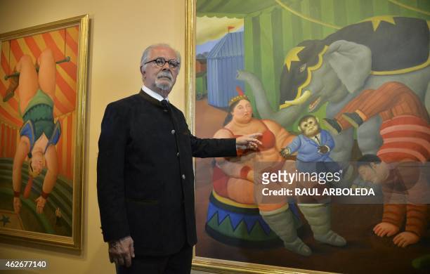 Colombian artist Fernando Botero poses next to a painting of the collection called "The Circus" during the opening at the Antioquia museum in...