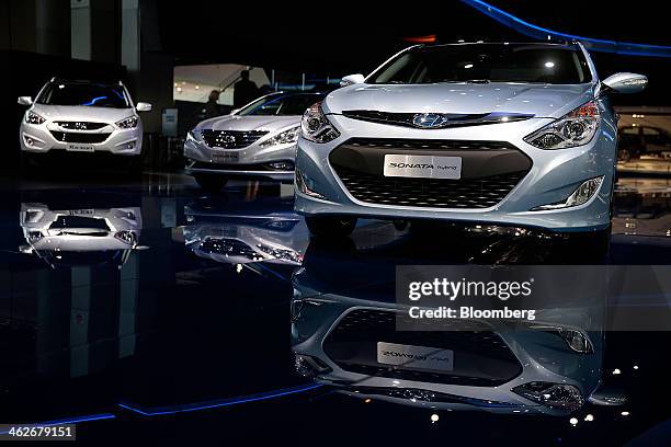 The Hyundai Motor Co. Sonata hybrid vehicle is displayed during the 2014 North American International Auto Show in Detroit, Michigan, U.S., on...