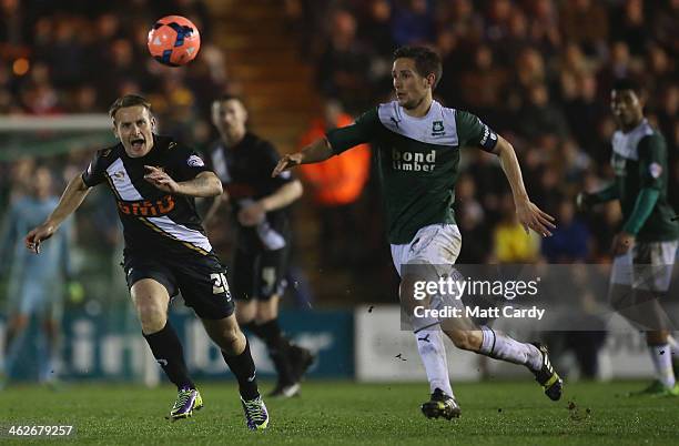 Chris Birchall of Port Vale and Conor Hourihane of Plymouth Argyle in action during the FA Cup third round replay between Plymouth Argyle and Port...