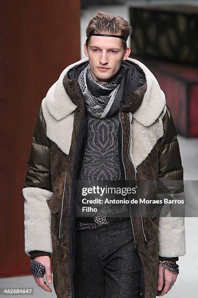 Model walks the runway during the Roberto Cavalli show as a part of Milan Fashion Week Menswear Autumn/Winter 2014 on January 14, 2014 in Milan,...