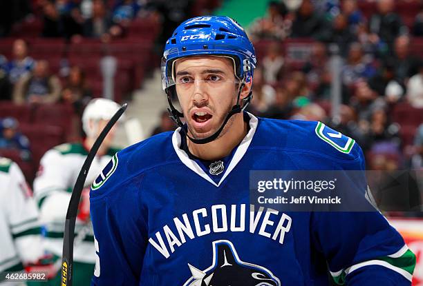 Frank Corrado of the Vancouver Canucks looks on from the bench during their NHL game against the Minnesota Wild at Rogers Arena February 1, 2015 in...