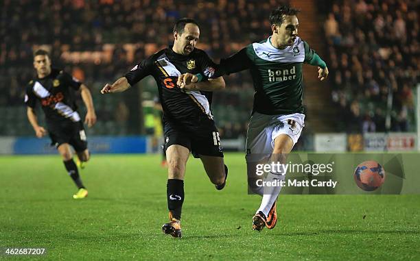 Port Vale's Chris Shuker and Plymouth Argyle's Max Blanchard during the FA Cup third round replay between Plymouth Argyle and Port Vale at Home Park...