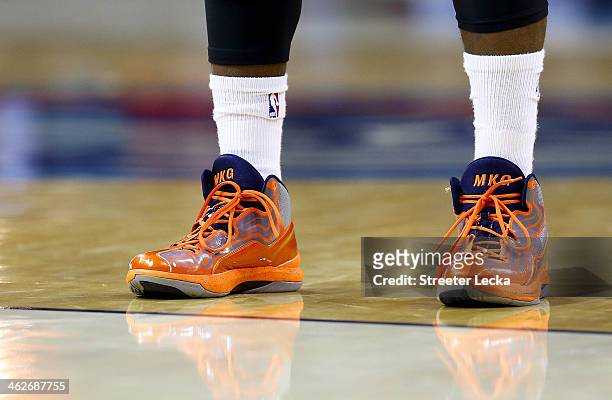 Michael Kidd-Gilchrist of the Charlotte Bobcats shoes during their game at Time Warner Cable Arena on November 11, 2013 in Charlotte, North Carolina....