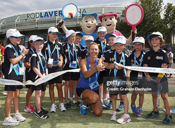 Tennis Hot Shots Ambassador Alicia Molik and 2013 MLC Tennis Hot Shot of the Year winner Jayla Tran cut the ribbon to open the gates to Melbourne...