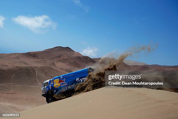 Andrey Karginov, Andrey Mokeev and Igor Devyatkin of Russia for Kamaz Master compete in stage 9 during Day 10 of the 2014 Dakar Rally on January 14,...