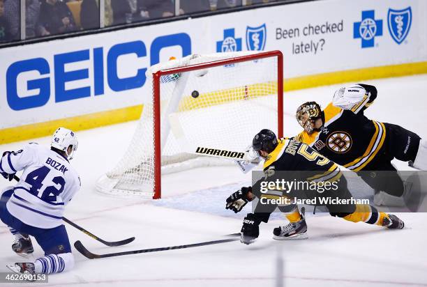 Tyler Bozak of the Toronto Maple Leafs shoots and scores his second goal past Tuukka Rask of the Boston Bruins in the second period during the game...