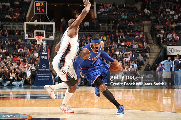 Carmelo Anthony of the New York Knicks drives against the Charlotte Bobcats during the game at the Time Warner Cable Arena on January 14, 2014 in...