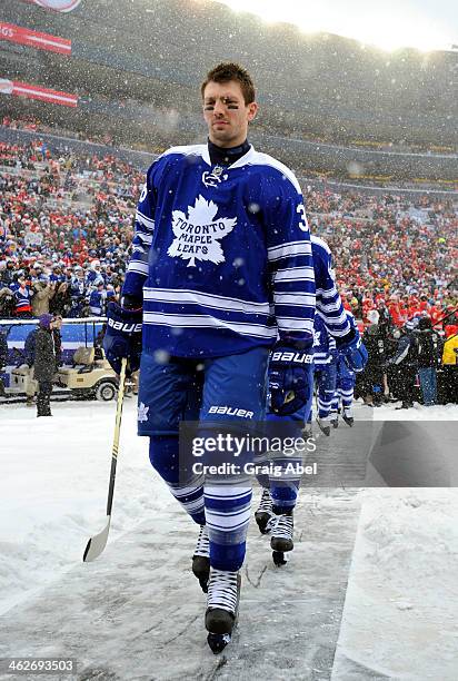 Frazer McLaren of the Toronto Maple Leafs walks to the ice against the Detroit Red Wings during NHL game action during the 2014 Bridgestone NHL...