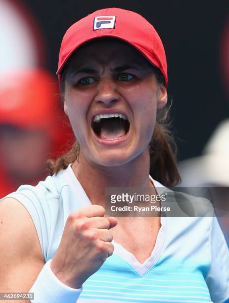 Monica Niculescu of Romania celebrates winning her second round match against Sabine Lisicki of Germany during day three of the 2014 Australian Open...