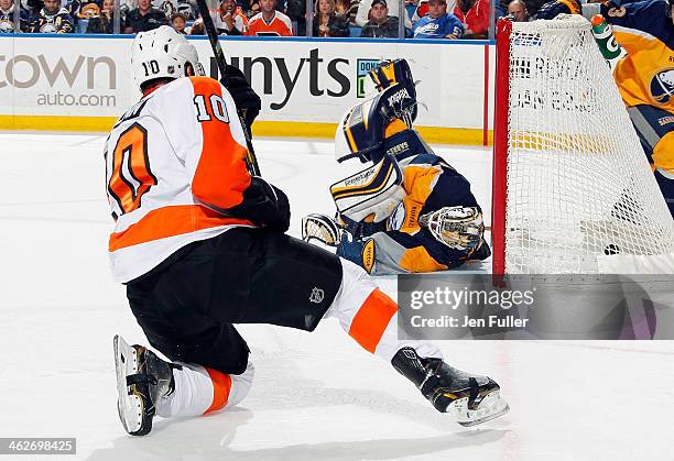 Brayden Schenn of the Philadelphia Flyers scores a third-period goal against Jhonas Enroth of the Buffalo Sabres on January 14, 2014 at the First...