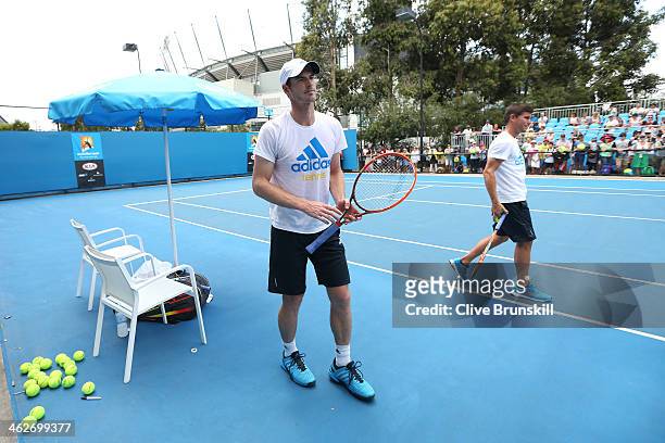 Andy Murray of Great Britain and Daniel Vallverdu prepare for a practice session on day three of the 2014 Australian Open at Melbourne Park on...