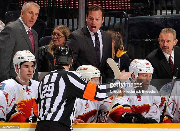Assistant coach Martin Gelinas of the Calgary Flames argues with referee Ian Walsh after a Flames goal was waived off against the Nashville Predators...